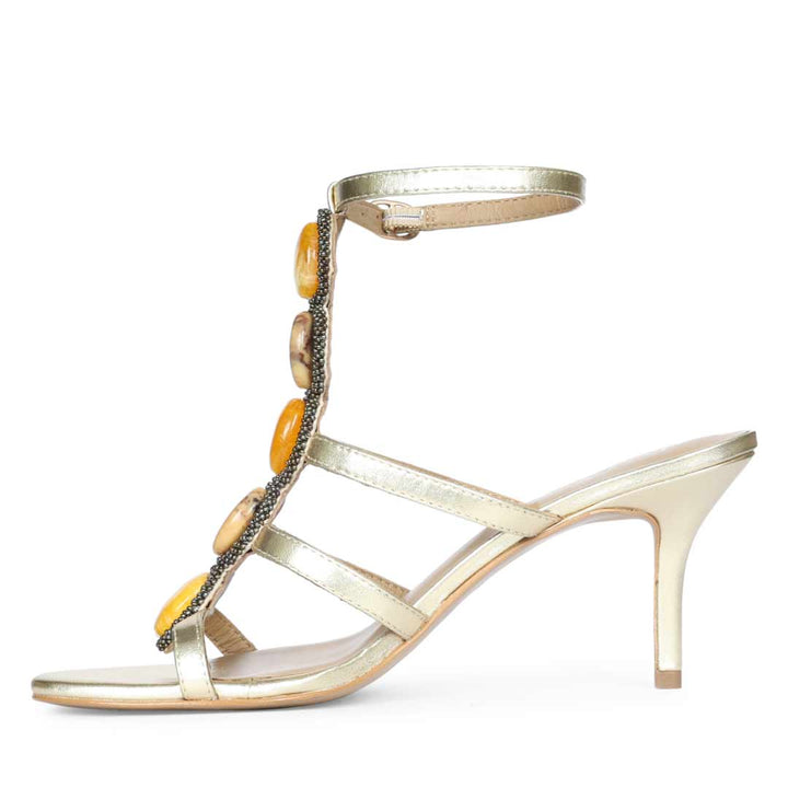 Saint Monroe multi stone embellished metallic gold leather stilettos, angled view