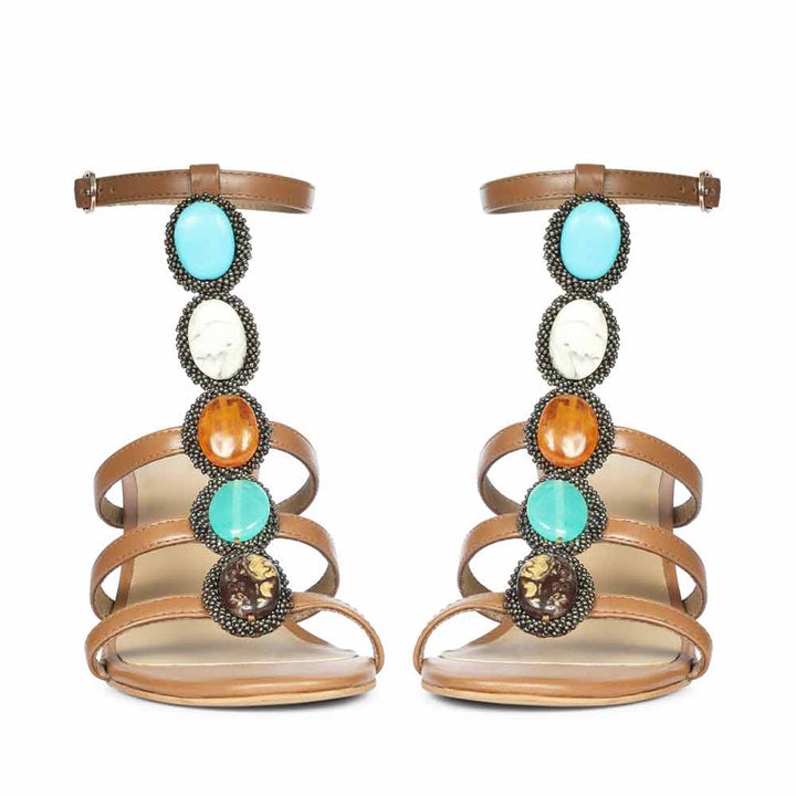 Saint Monroe tan leather stilettos, pair view showing multi stone embellishment