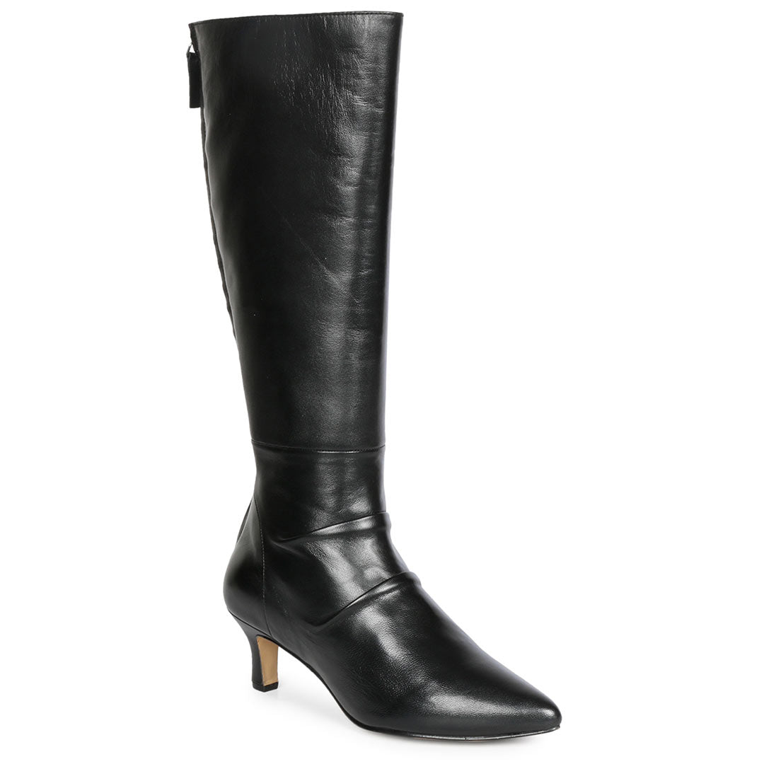 Close-up of slouchy leather texture on Saint Nadine black knee high boots