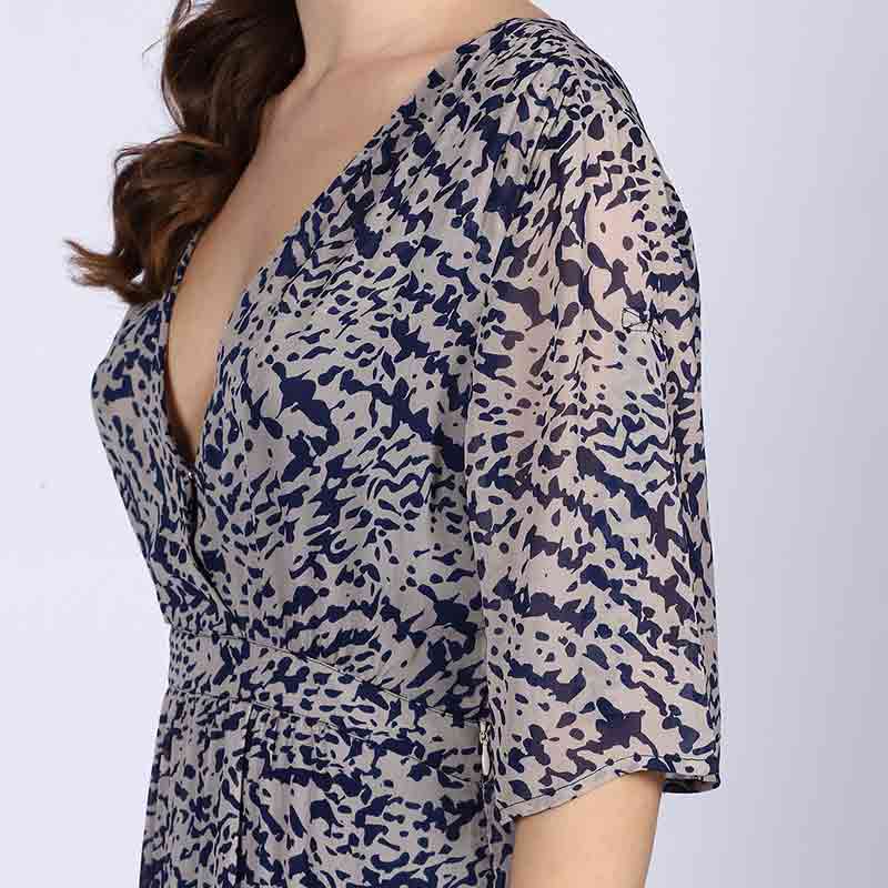 Close-up of V-neck wrap bodice on Saint navy abstract print viscose mini dress for women UK.
