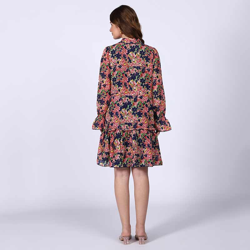 Women's blue multi bloom mini dress by Saint Nerina, back view.