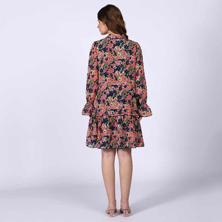 Women's blue multi bloom mini dress by Saint Nerina, back view.