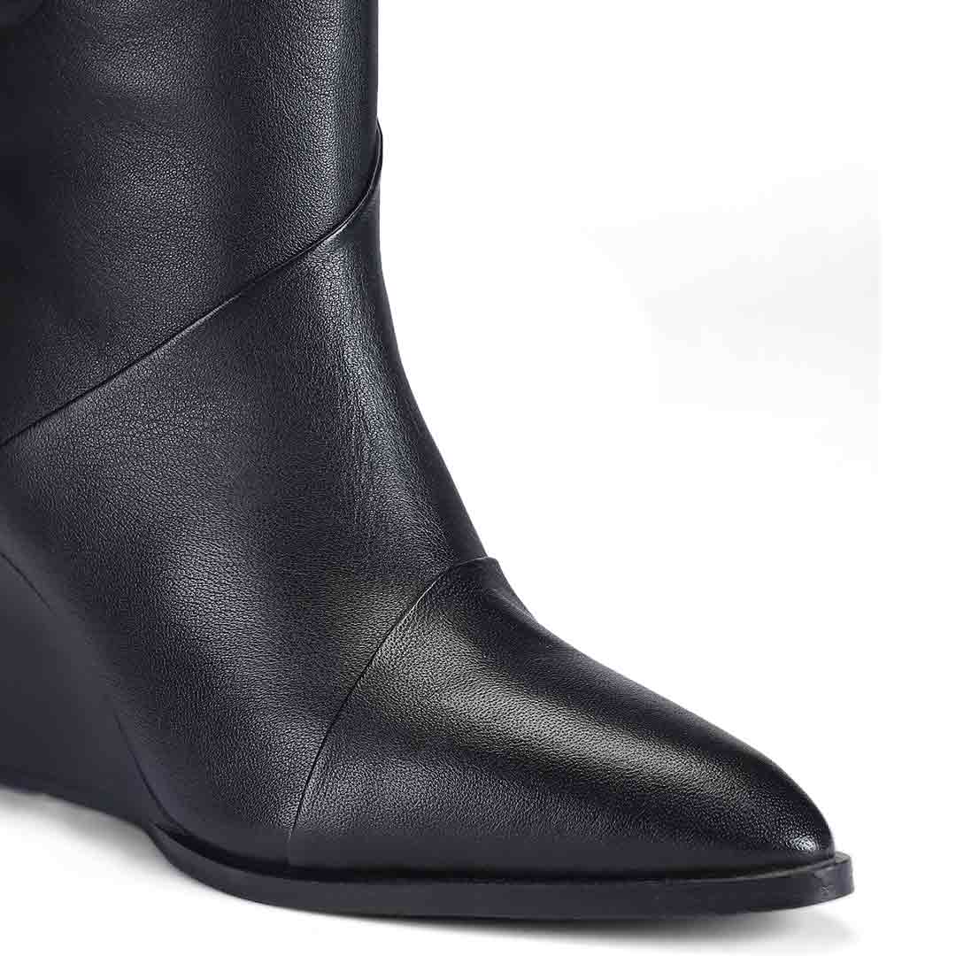 Close-up of folded seam detail on Saint Novara black leather wedge knee high boots