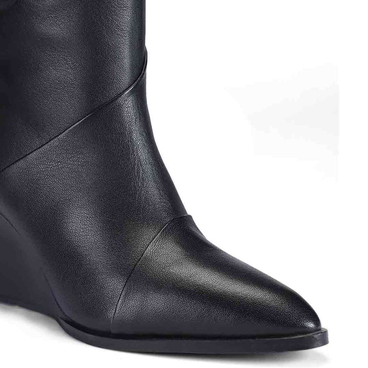 Close-up of folded seam detail on Saint Novara black leather wedge knee high boots