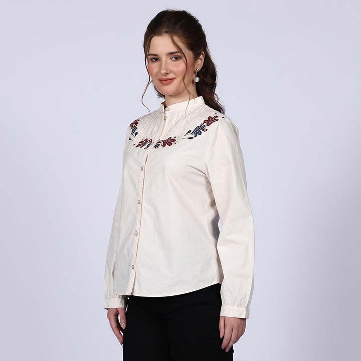 Saint off-white floral embroidered cotton top for women UK, three-quarter front view.