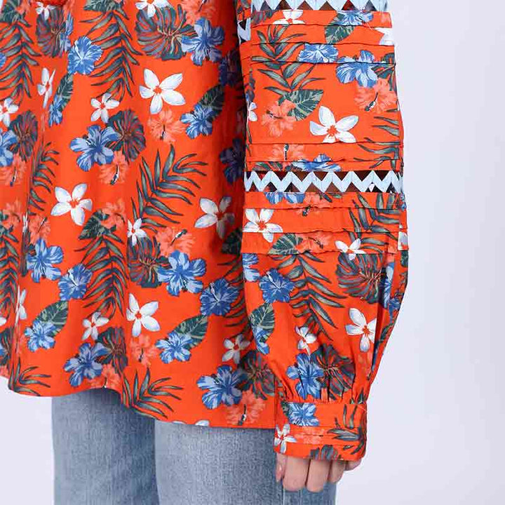 Close-up of zigzag trim on sleeve of Saint orange multicolour floral cotton top for women UK.