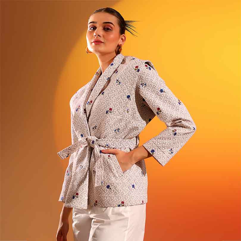Saint Oriana beige geometric floral print wrap jacket for women UK, three-quarter front view.
