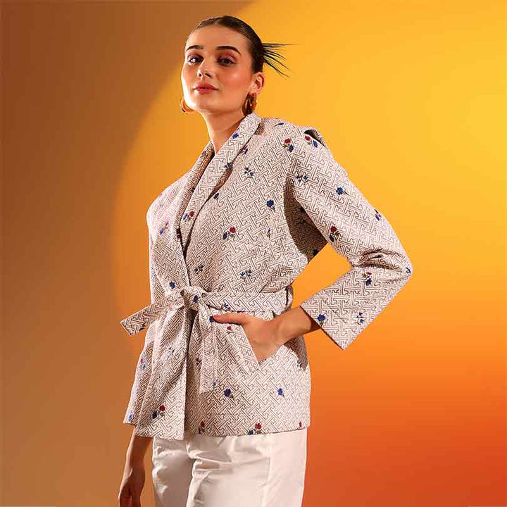 Saint Oriana beige geometric floral print wrap jacket for women UK, three-quarter front view.