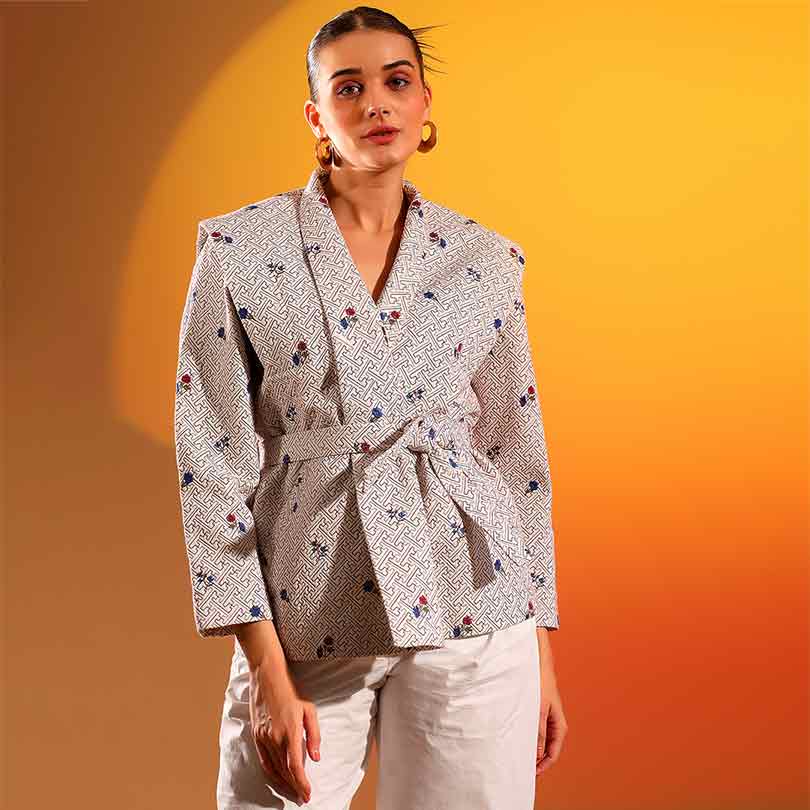 Women's beige geometric floral print wrap jacket by Saint Oriana, front view.
