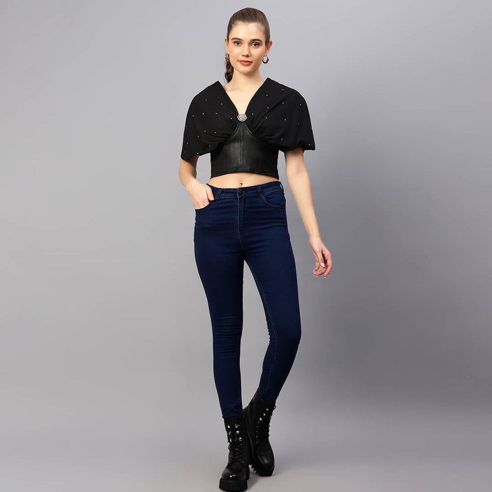 Women's black leather corset top UK by Saint Oriana, styled full-length lifestyle shot with jeans