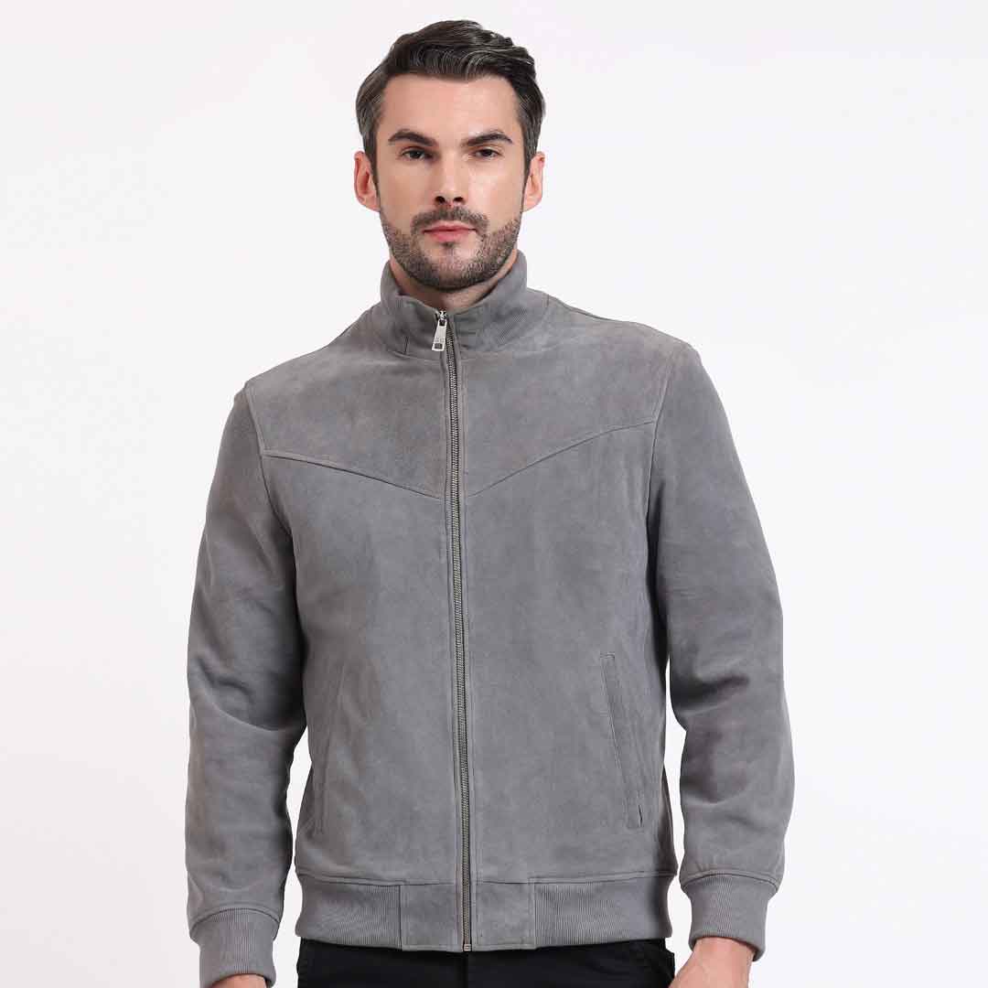 Man wearing a grey jacket with a stand collar and zip front.