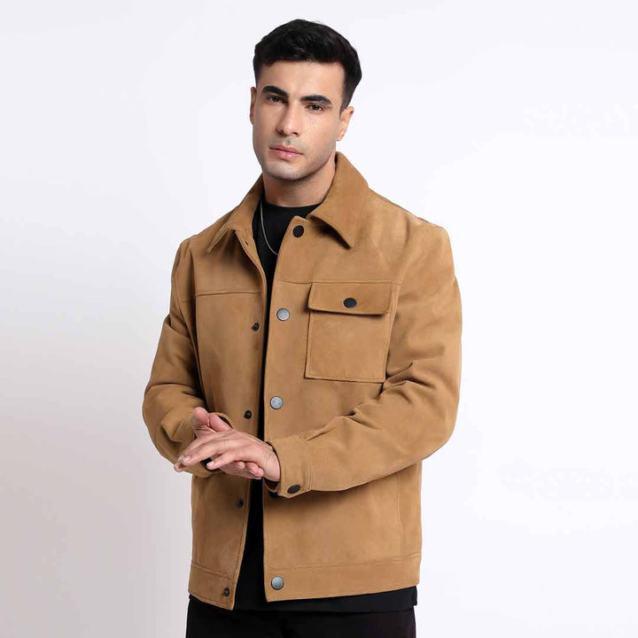 Man wearing a buttoned sand suede jacket with a flap chest pocket.