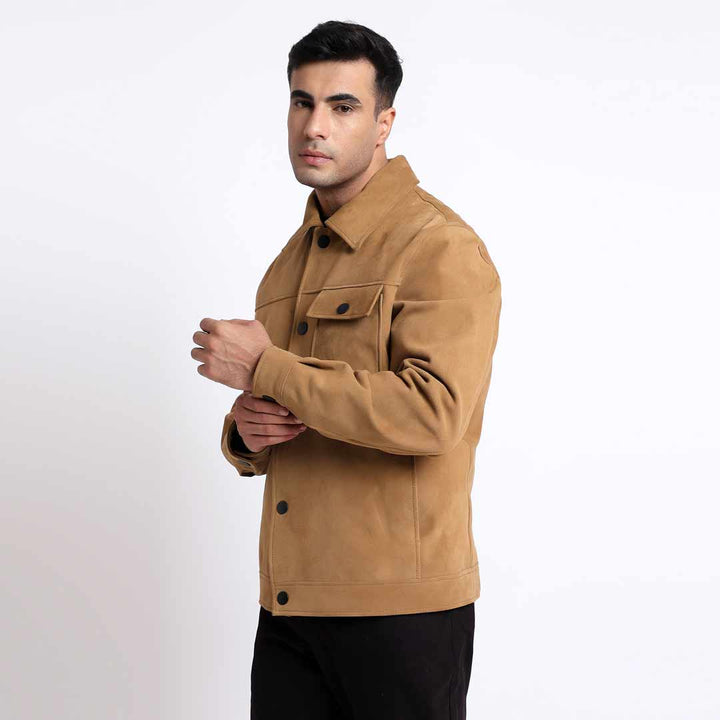 Side view of a man wearing a sand suede jacket with snap-button front.