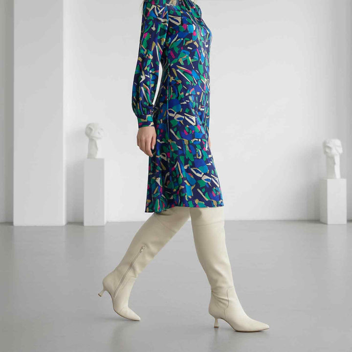 Women's beige above the knee boots UK by Saint Primrose, styled walking lifestyle shot
