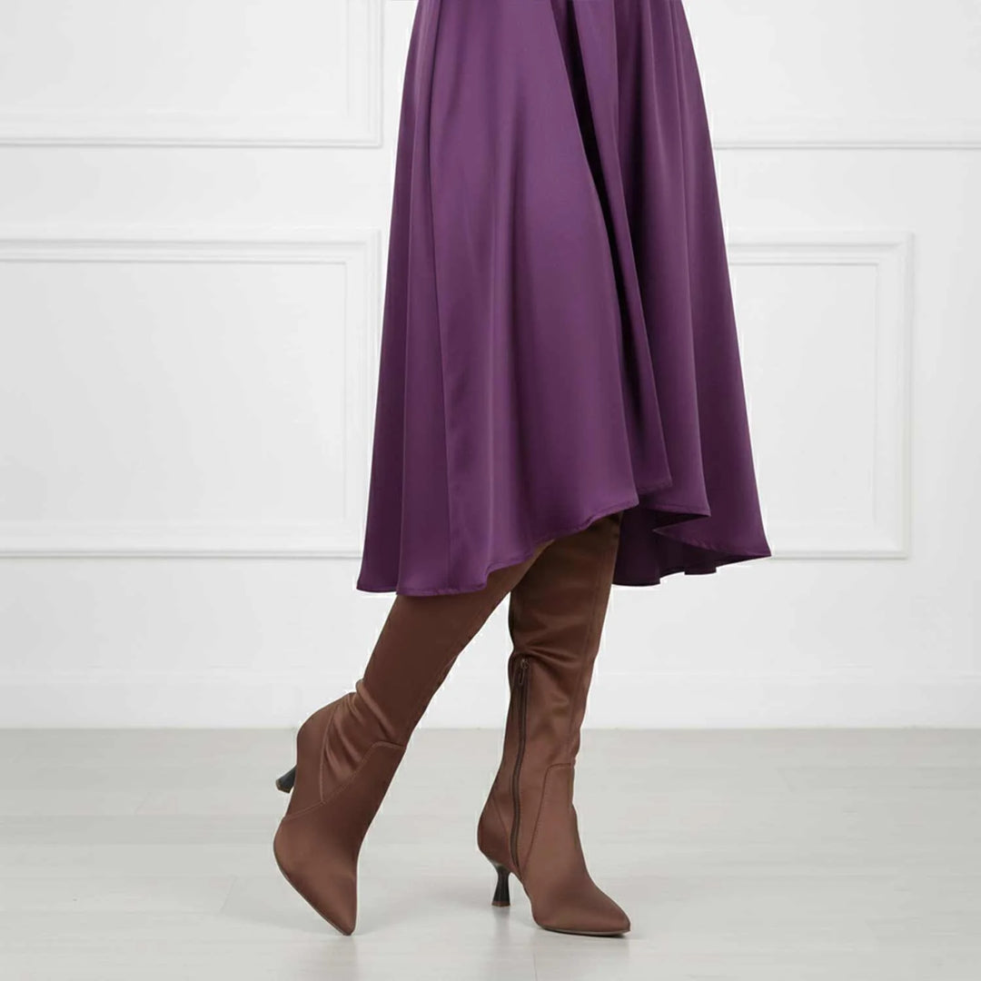 Women's brown satin above the knee boots UK by Saint Primrose, styled walking lifestyle shot