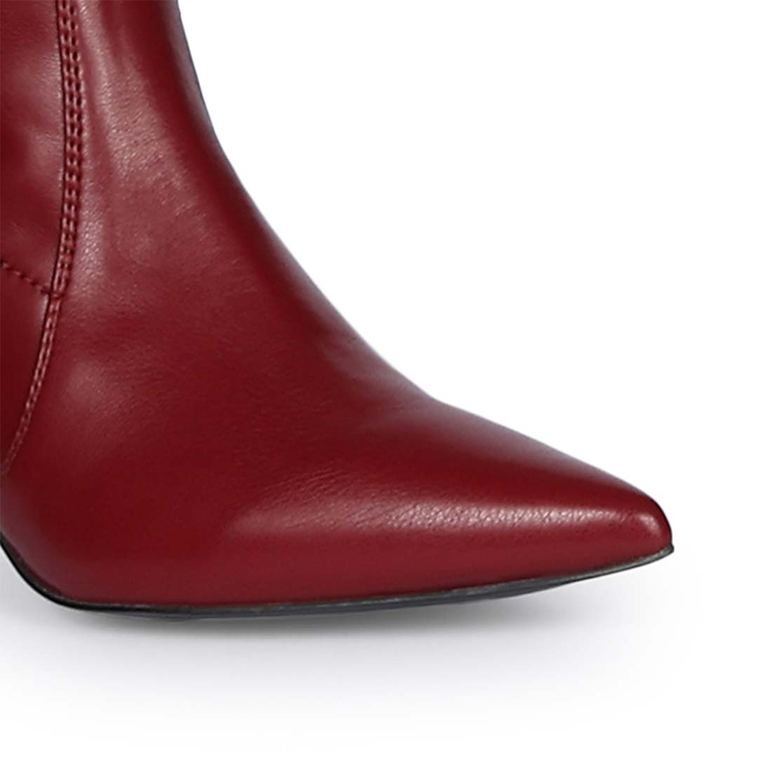 Close-up of pointed toe on Saint Primrose maroon above the knee boots UK