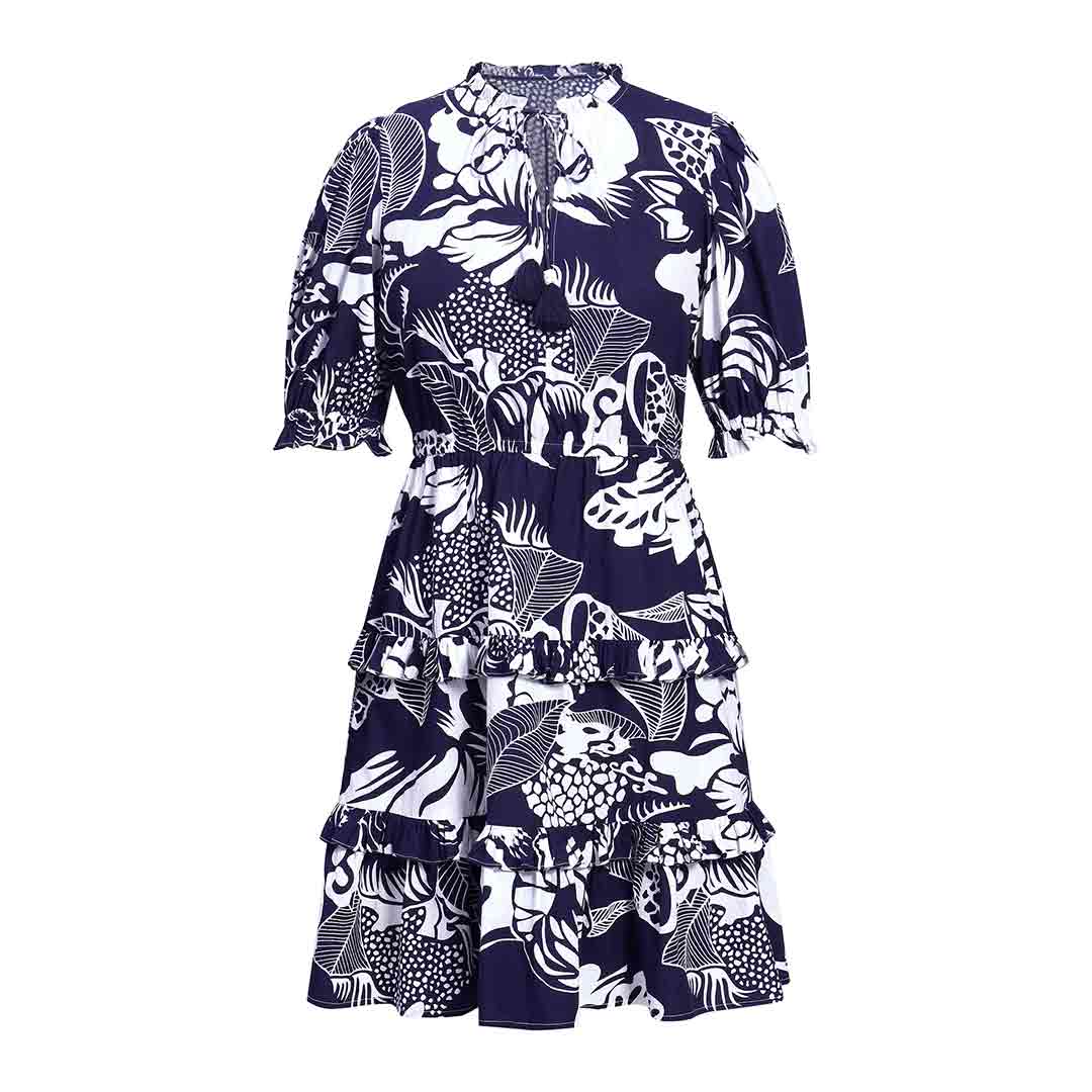Saint Quinn navy ivory tropical print tiered mini dress for women UK, shown flat with tie neck and puff sleeves.