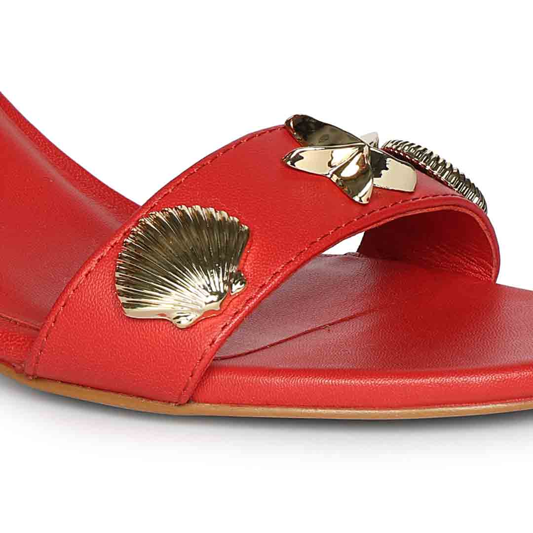 Close-up detail on Women's Saint Ravena Seashell & Star Embellished Goji Berry Leather Stilettos