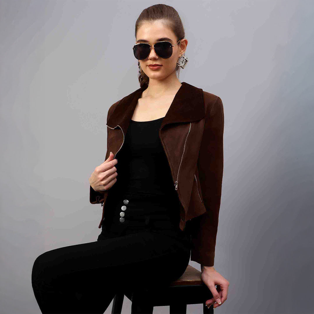Women's brown suede jacket UK by Saint Rebecca, styled seated lifestyle shot