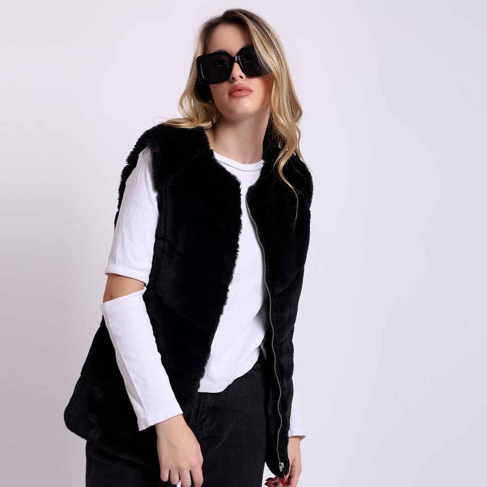 Women's black fur sleeveless vest UK by Saint Renata, styled lifestyle shot with sunglasses