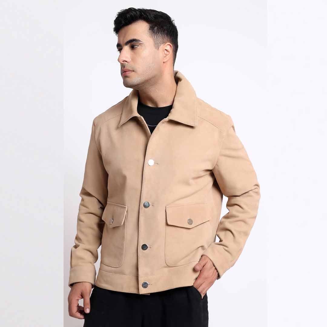 Side view of a man wearing a tan/beige suede jacket.
