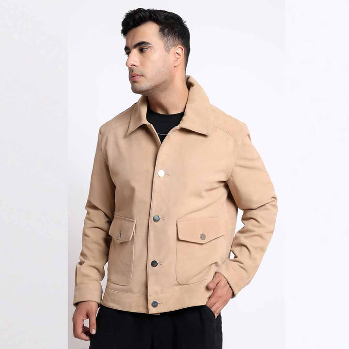 Side view of a man wearing a tan/beige suede jacket.