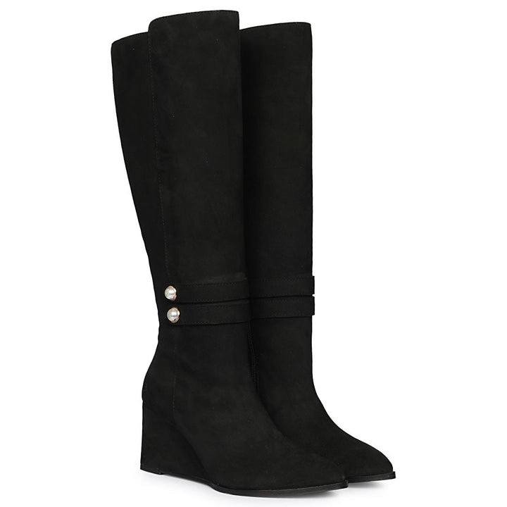 Black suede knee high boots for women UK, pair view showing pearl-button strap and wedge heel