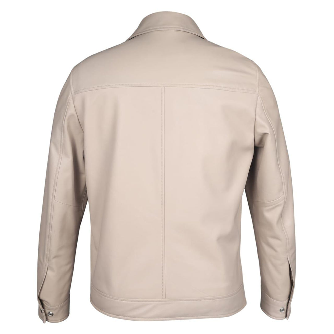 Full-length shot of a man wearing an off-white leather jacket.