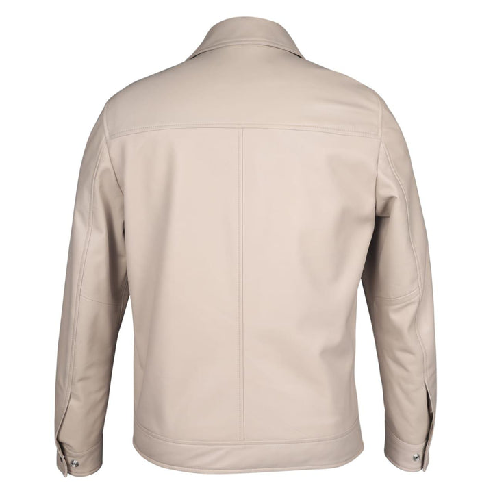 Full-length shot of a man wearing an off-white leather jacket.