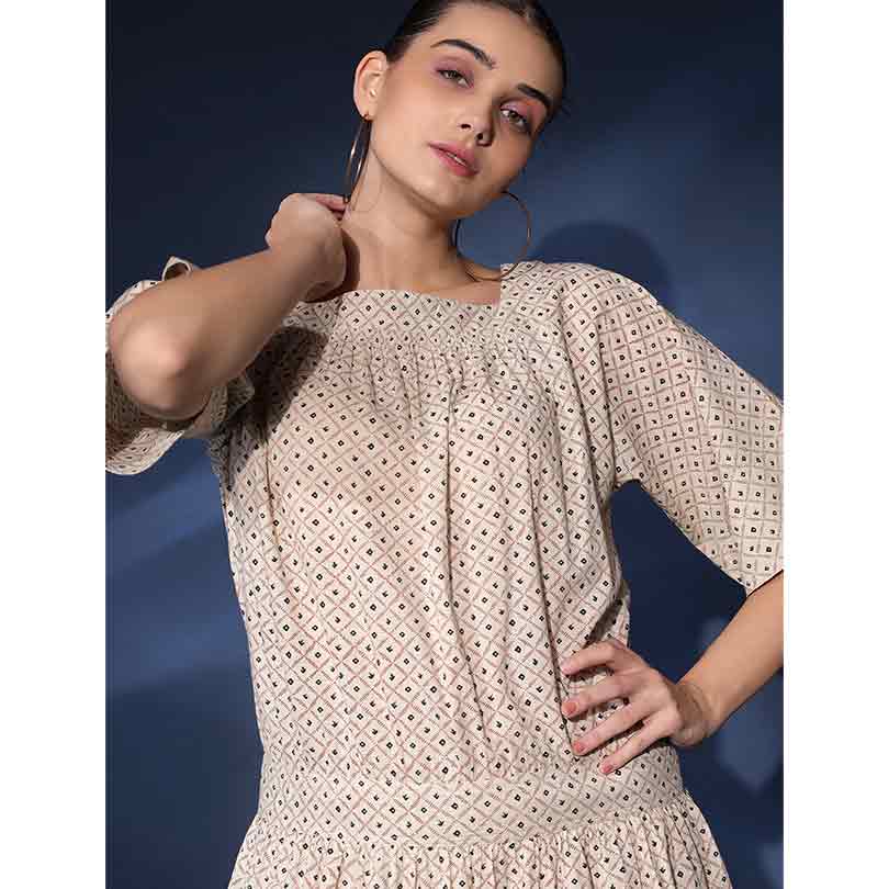 Close-up of square neckline and smocked bodice on Saint Saelora ivory diamond-print cotton short dress for women UK.
