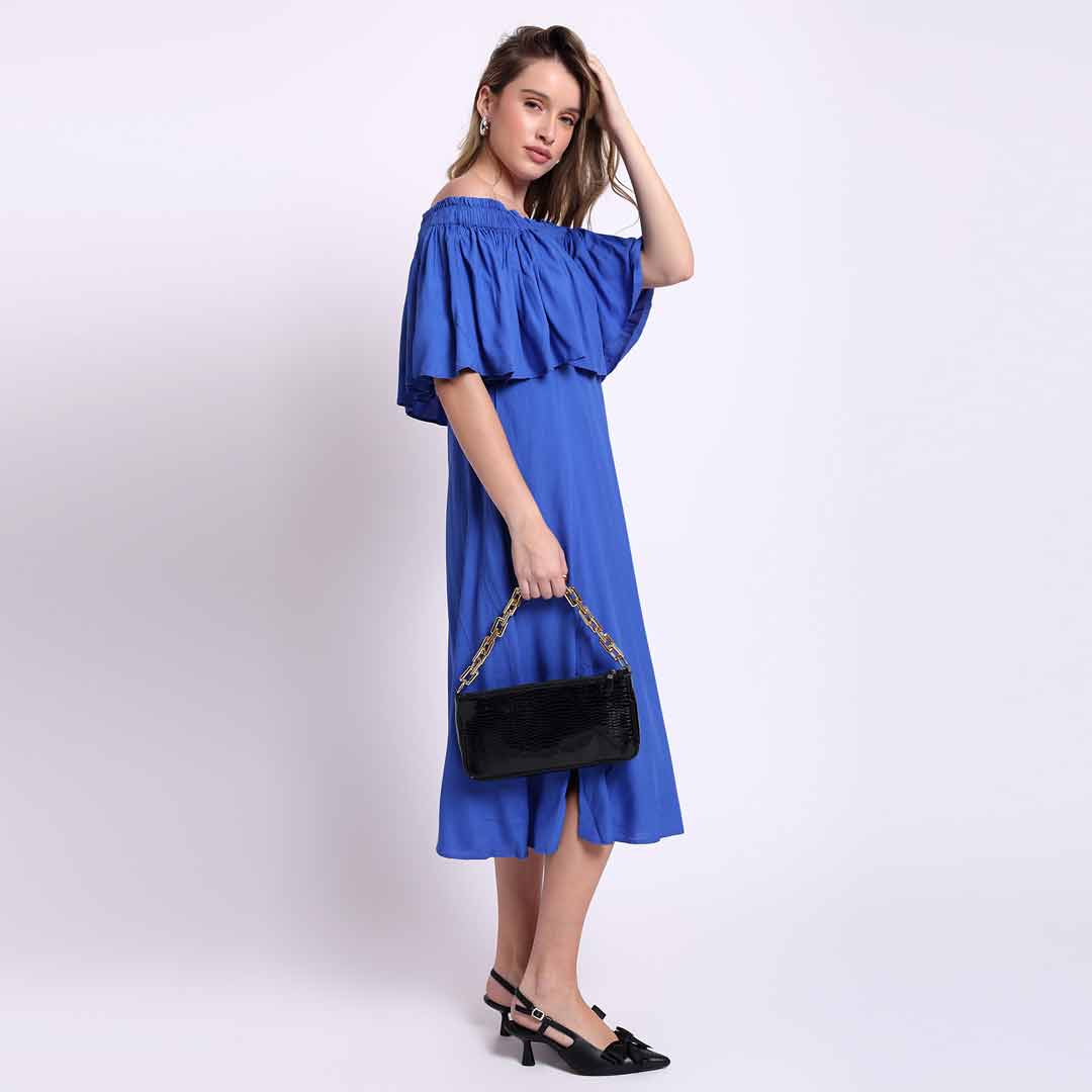 Saint Sephora blue off-shoulder midi dress for women UK, front view styled with a shoulder bag.