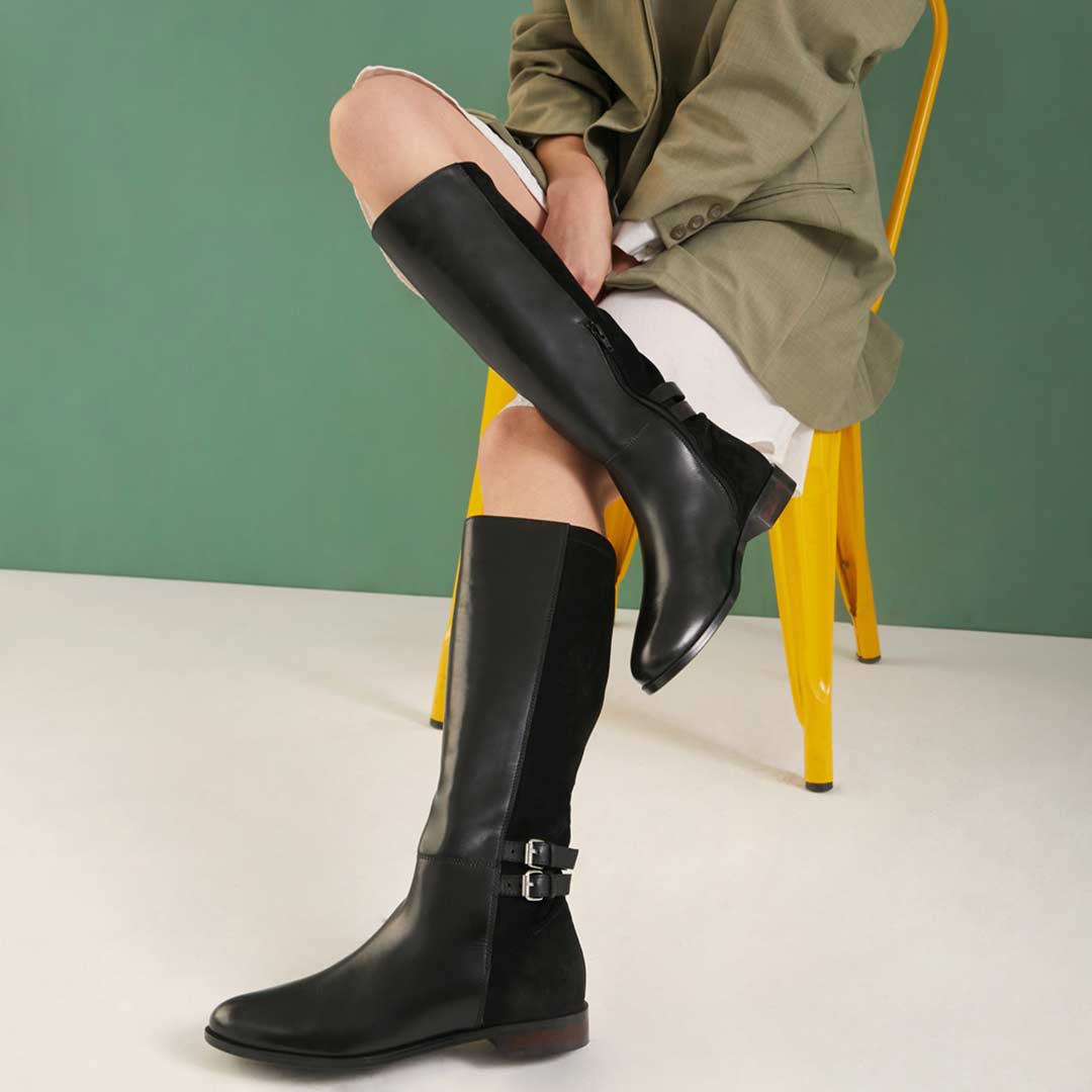 Women's black leather knee high boots by Saint Serafina, second styled lifestyle shot