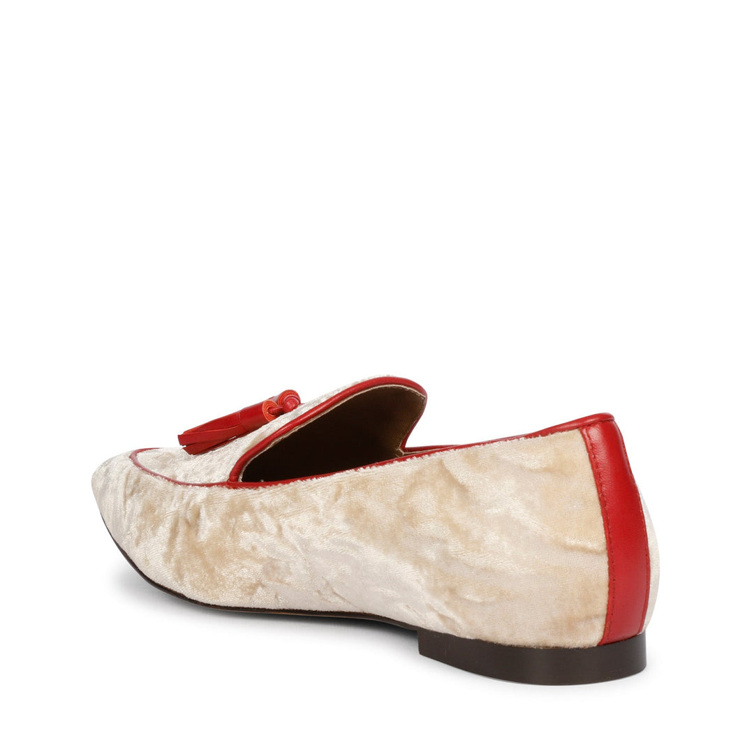 Ladies cream velvet tassel loafer moccasins with red trim, best women's three-quarter back view, UK