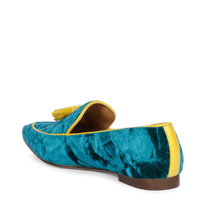 Ladies teal green crushed velvet tassel loafer moccasins with yellow trim, best women's three-quarter back view, UK