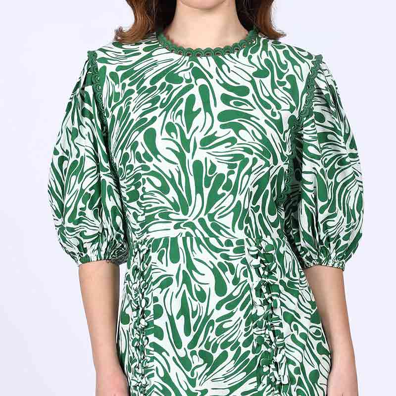 Close-up of puff sleeve and side-lacing on Saint Solene green swirl-print short dress for women UK.