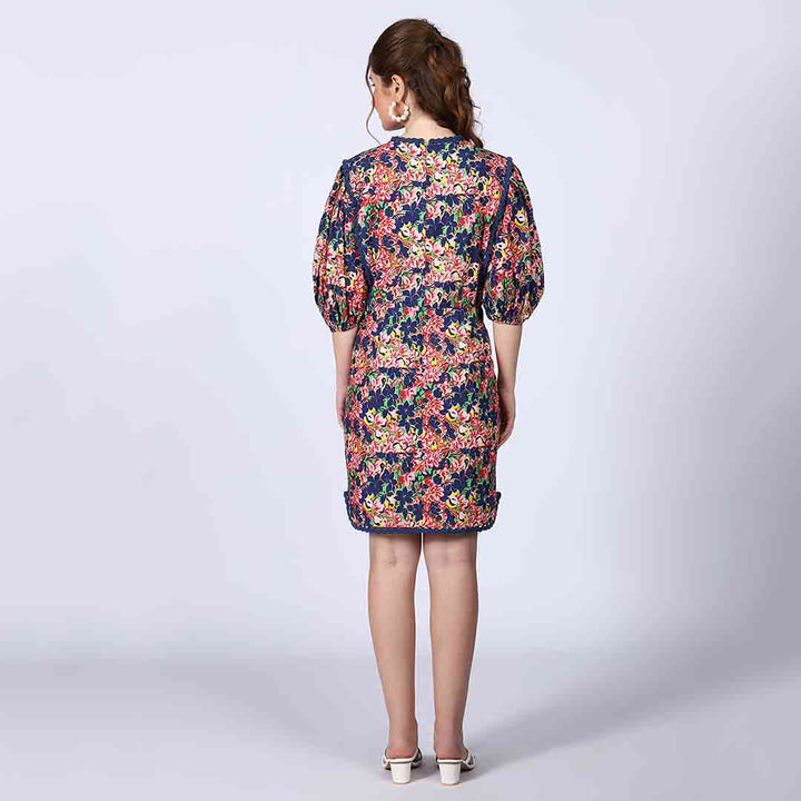 Women's multicolour floral short dress by Saint Solene, back view.