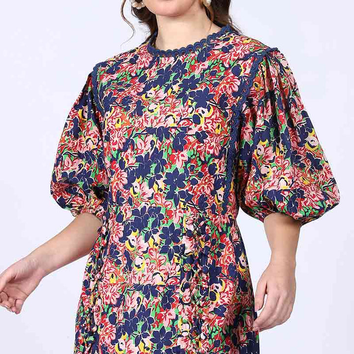 Close-up of puff sleeve and scalloped trim on Saint Solene multicolour floral short dress for women UK.