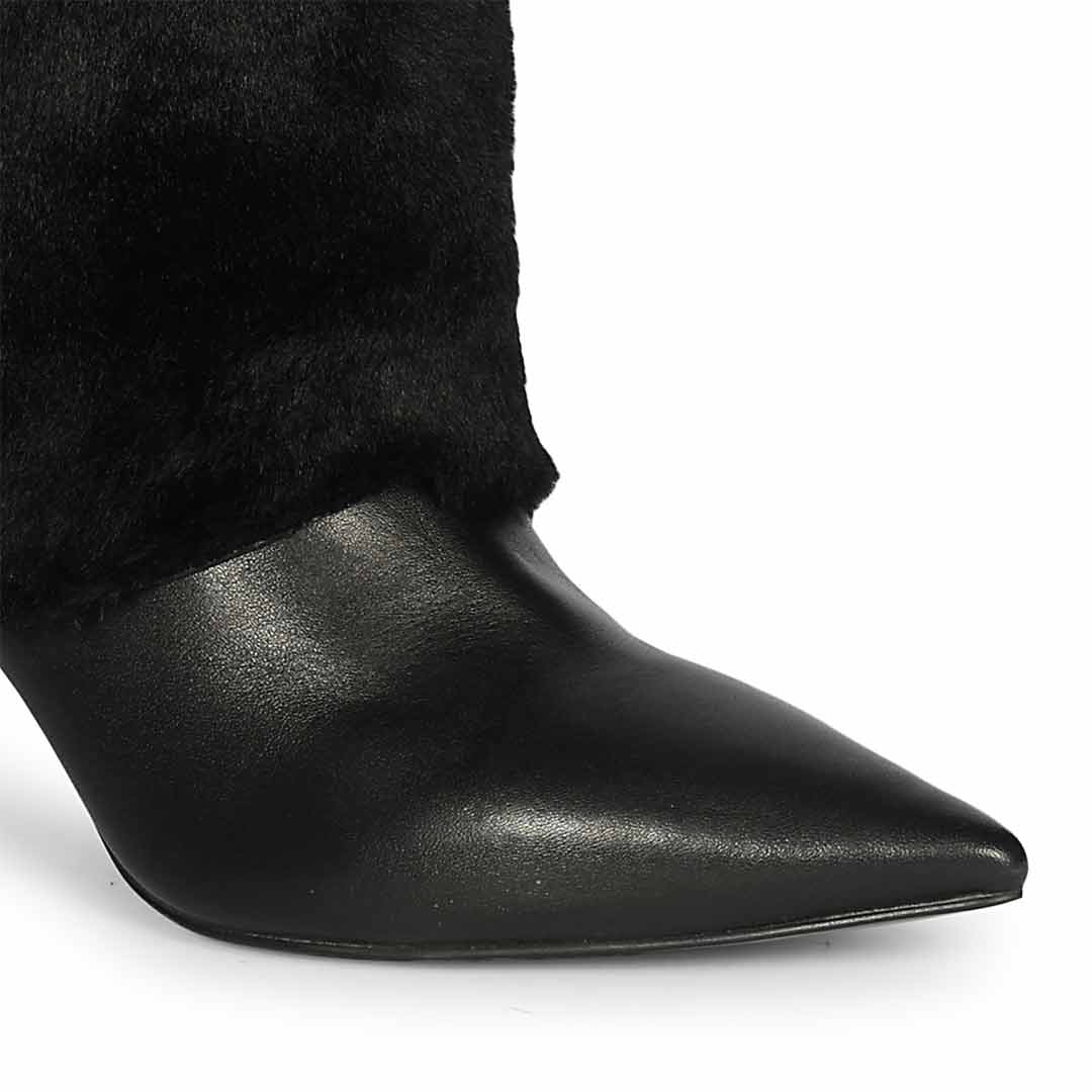 Close-up of fur-to-leather transition on Saint Solveig black knee high boots