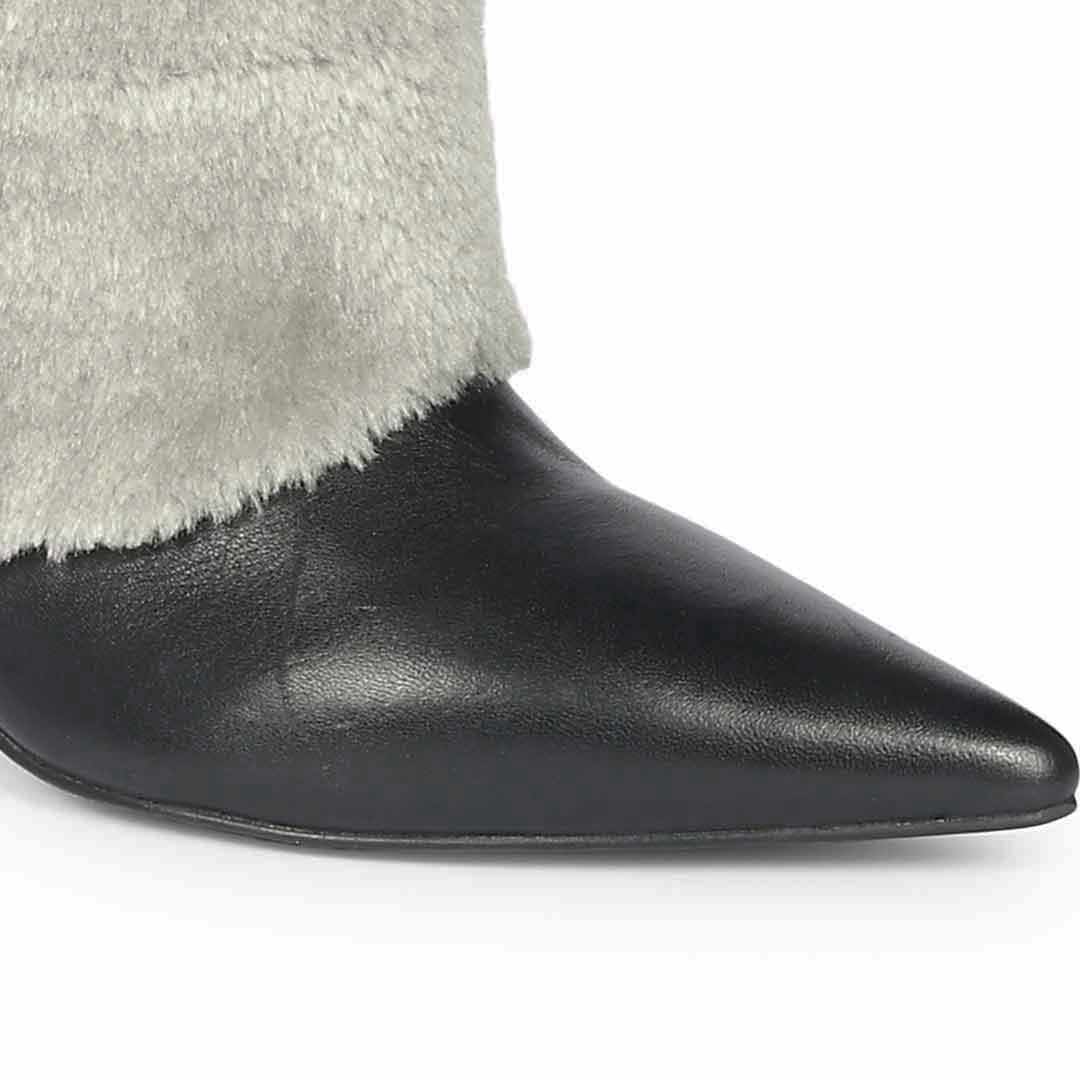 Close-up of grey fur-to-leather transition on Saint Solveig knee high boots