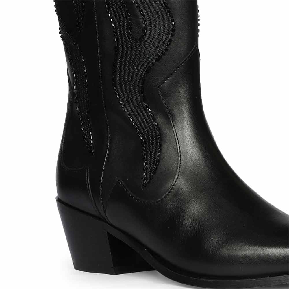 Close-up of tonal flame embroidery on Saint Tiziana black leather knee high boots