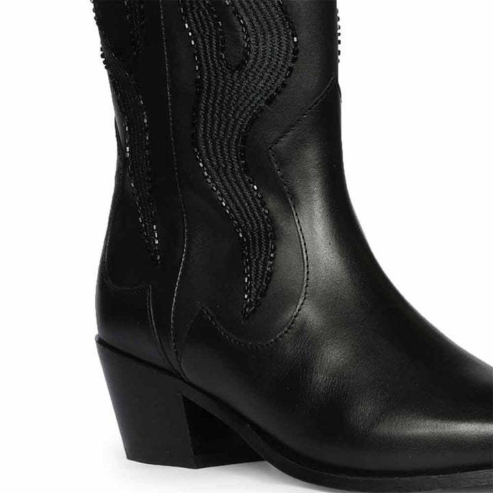 Close-up of tonal flame embroidery on Saint Tiziana black leather knee high boots