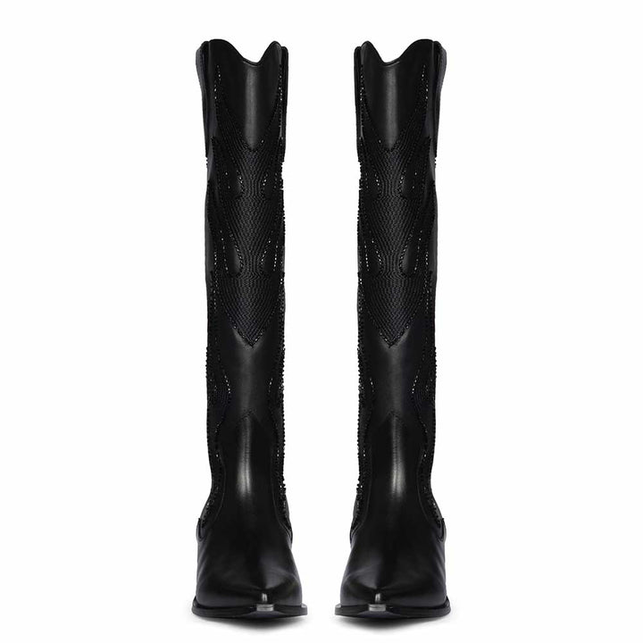 Women's black knee high boots, front pair view of tonal flame embroidery