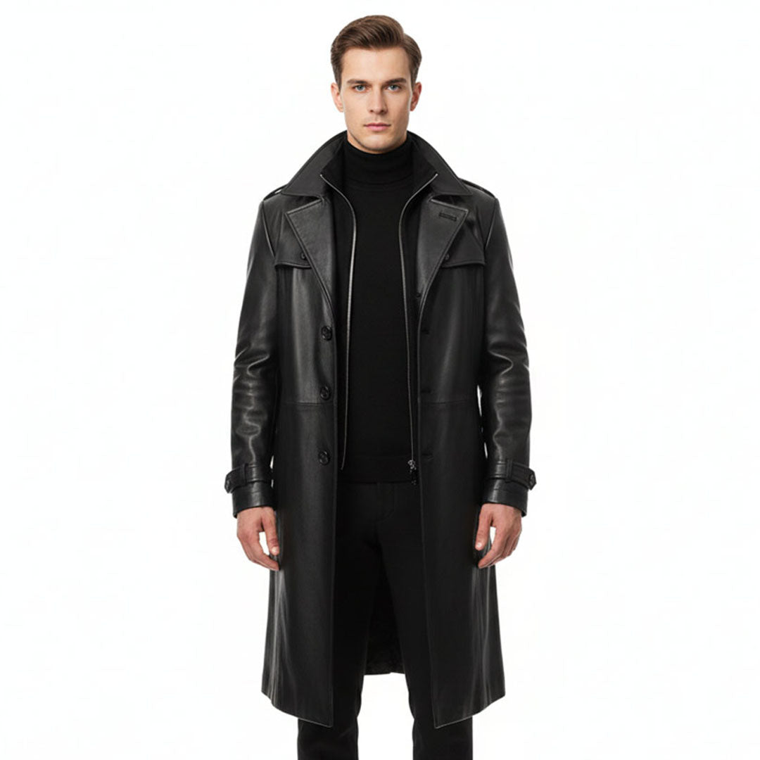 Man wearing a full-length black leather trench coat with a notched collar.