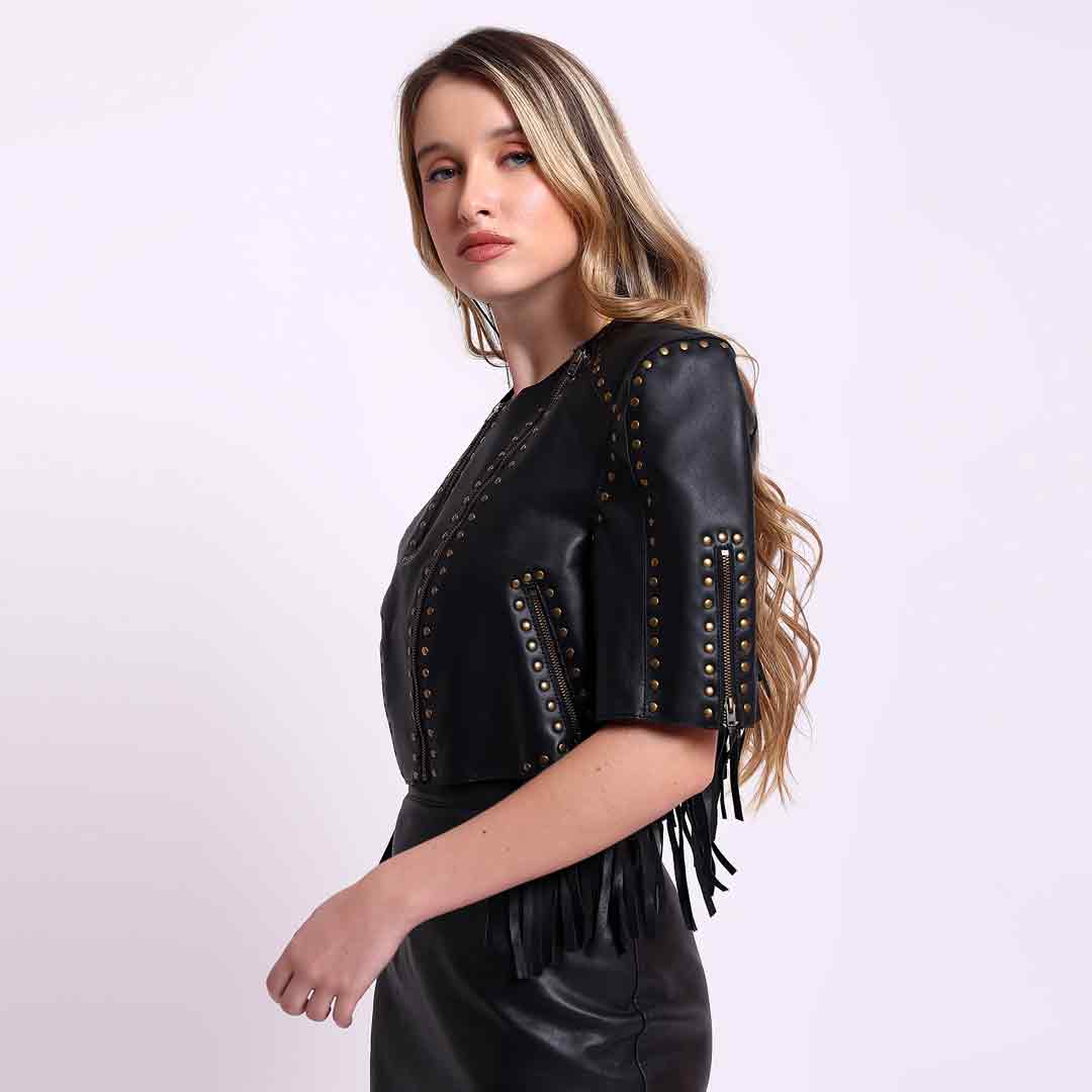Metal studded leather short jacket for women UK, side view showing fringe trim at hem