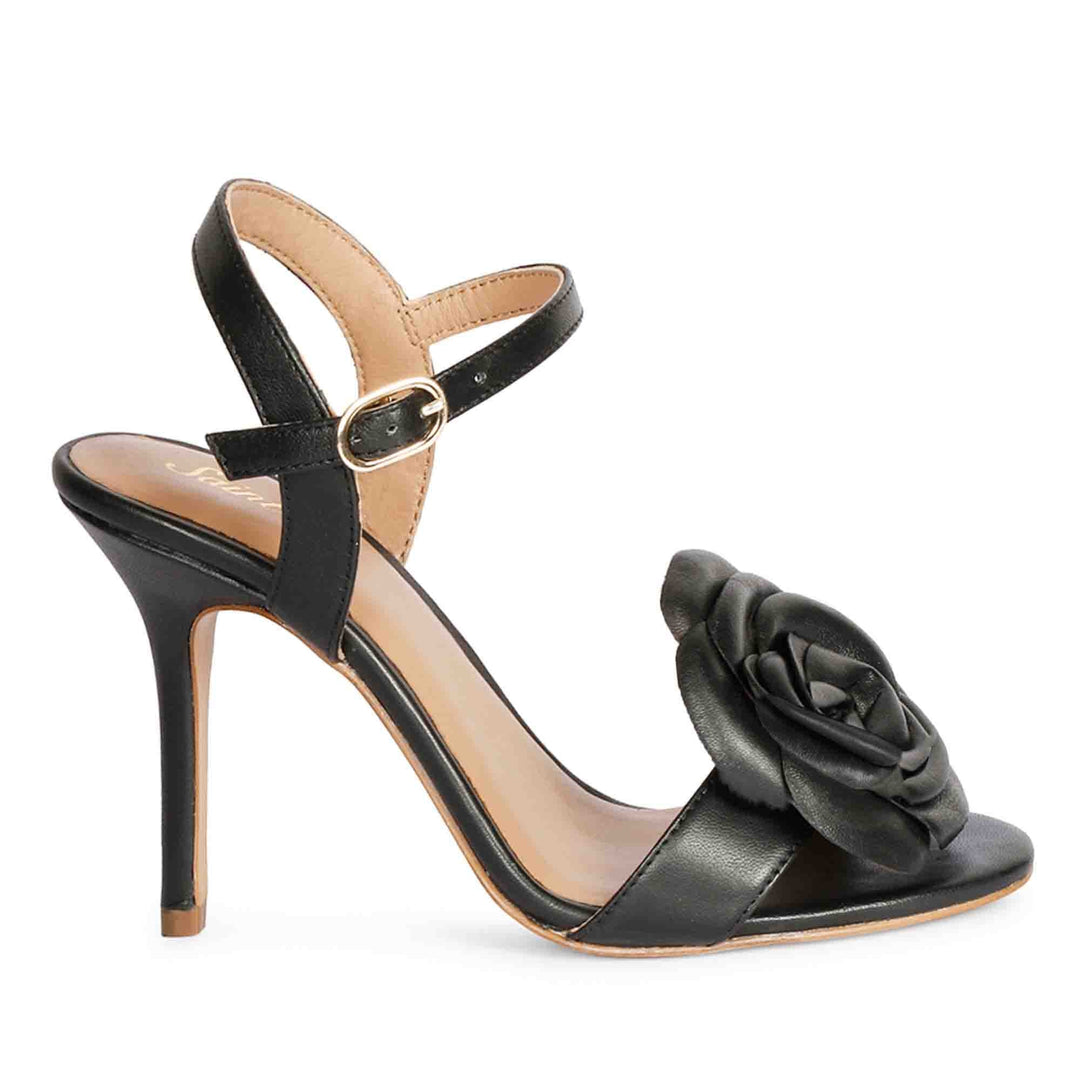 Saint Veronique flower embellished black leather stilettos, side view