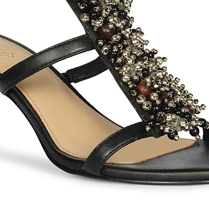Close-up detail on Saint Vesper Embellished Black Leather Stilettos