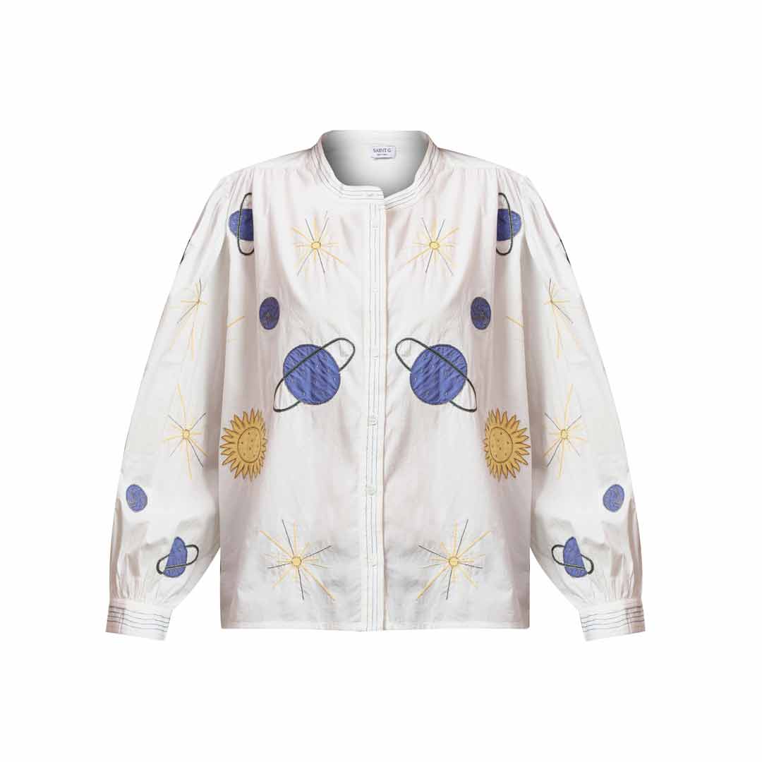 Women's white celestial applique cotton shirt by Saint, shown flat with planet and sun appliqué motif.