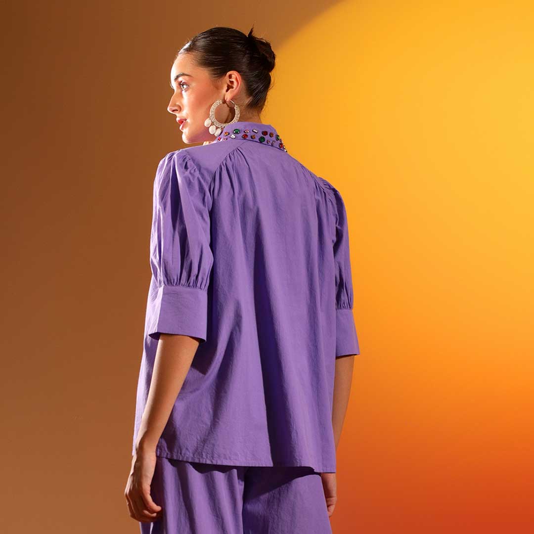 Full-length shot of a UK woman wearing a lilac purple embellished shirt