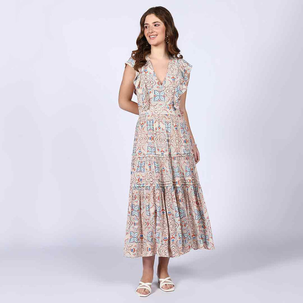 Woman wearing a beige multicolour printed maxi dress, ankle length.