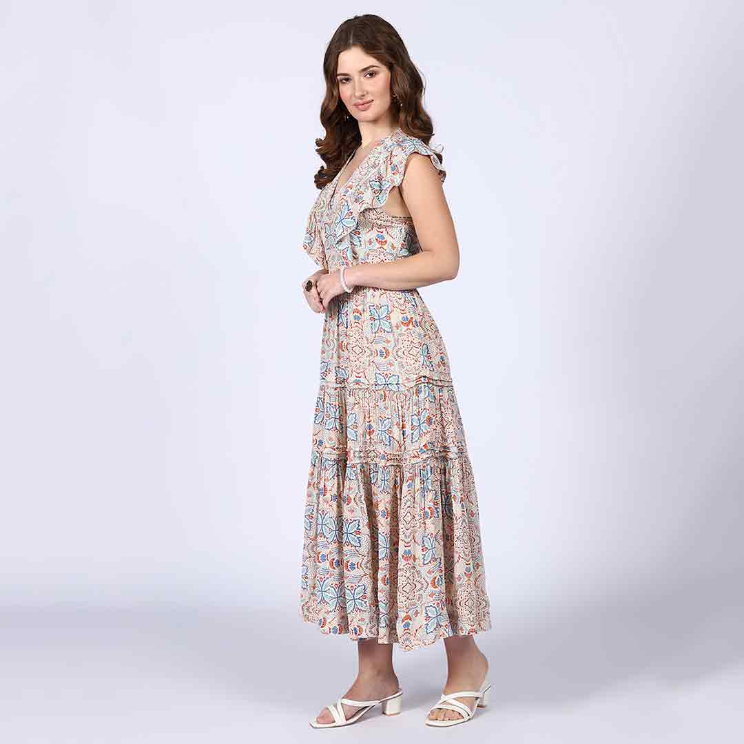 Side view of a woman wearing a beige multicolour printed maxi dress.